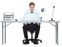 man sitting at table with laptop